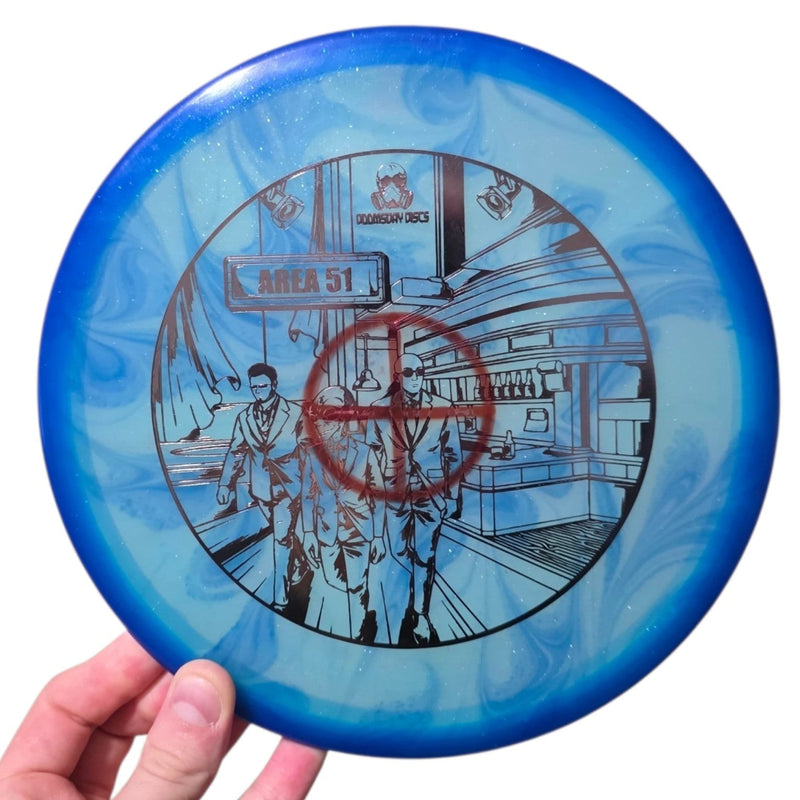 Cobalt and turquoise dye on Doomsday Discs Area 51 in Clandestine plastic, overhead view