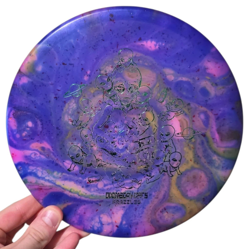 Violet and pink dye on Doomsday Discs Area 51 in Clandestine plastic, overhead view