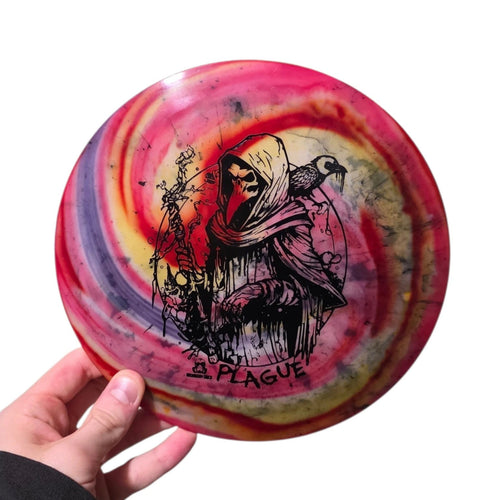 Pink and olive dye on Doomsday Discs Plague in Radioactive Waste plastic, overhead view