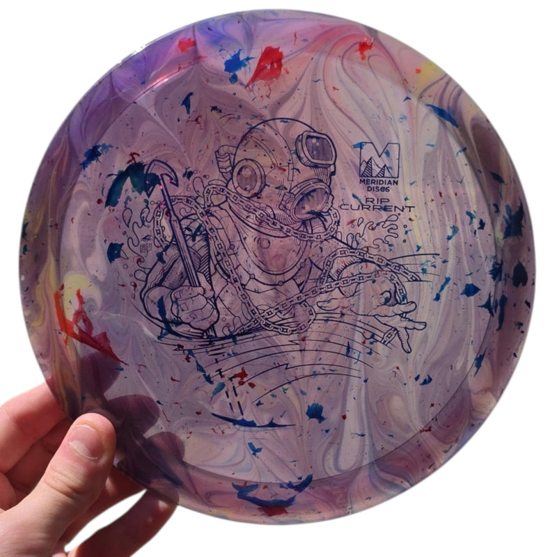 Front of hand-dyed Meridian Rip Current in Marbled Clarus plastic with blue and red dye across the marbled plate