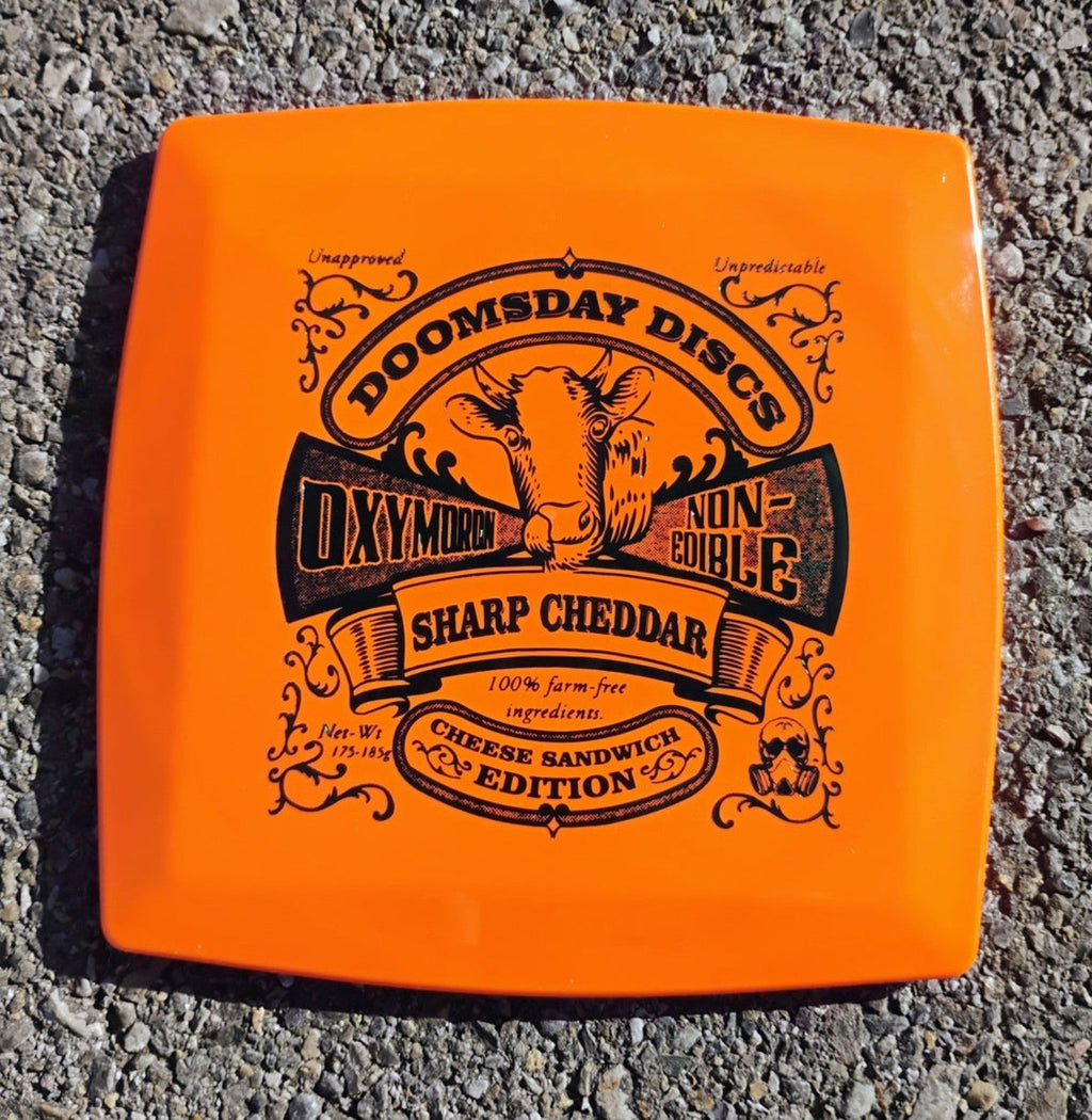 Orange square Survival Oxymoron with black Sharp Cheddar Cheese Sandwich Edition stamp